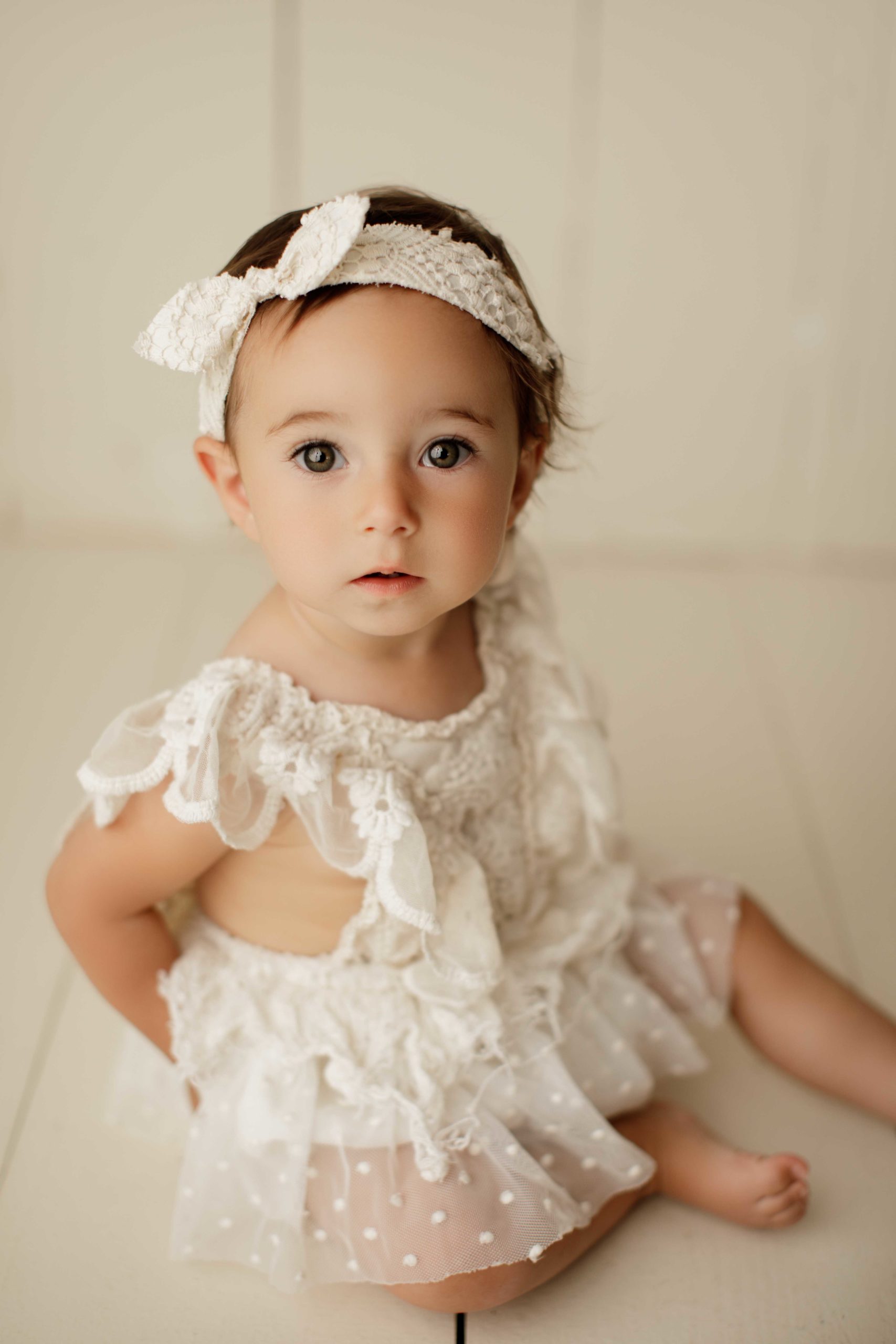 Toddler girl in lacy off white dress